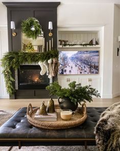 a living room filled with furniture and christmas decorations