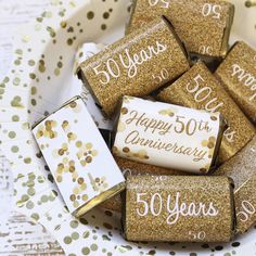 gold and white 50th birthday party favors in a bowl