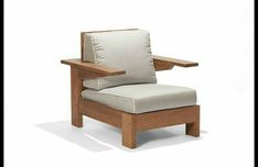 a chair that is made out of wood and has a cushion on the armrest