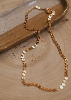 Because who wouldn’t want to wear confetti?! This chain catches the light with every subtle movement. Available in 16" or 18" lengths. Available in 14kt Gold Fill + Sterling Silver. Jess B layers it with our Herra Chain. Handmade in Eau Claire, WI. Our jewelry is handmade so each piece will be unique and may vary slightly from what is pictured. Jewelry Wishlist, Adornment Jewelry, Everyday Wear Jewelry, Permanent Jewelry, Necklace Collection, Layered Chains, Jewelry Photography, Jewelry Cleaner, Unique Styles