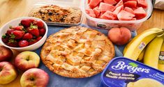 fresh fruit and other foods are laid out on a table