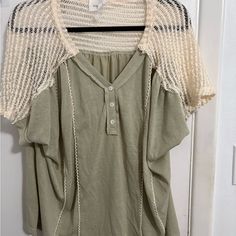 The Details In This Top Are So Good! From The Crocheted Knit Sleeves To The Functional Button Down Neckline And Trimmed Vertical Design - The Fact That This Is Andree By Unit At An Unbeatable Price - Do Not Miss Out! The Fabric Is A Light And Breezy Cotton Blend To Be Ultra Breathable This Season! Perfect To Pair With Denim, Khaki, White And More! Fit: True To Size Gives A Relaxed Fit Throughout. If You Like A Closer Fit, You Can Size Down One. This Top Is Light And Stretchy With A Loose Drape T Green Knit Tops With Buttons, Knit Top With Buttons For Spring, Cream Tops With Button Closure For Layering, Cream Knit Top With Button Closure, Knit Tops With Buttons For Spring, Spring Knit Tops With Buttons, Knit Tops With Buttons For Day Out, Knit Tops With Button Closure For Day Out, Cream Knit Tops With Buttons