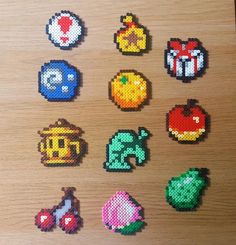 several pixelated objects are displayed on a wooden surface