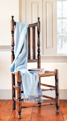 a chair with a blanket on top of it