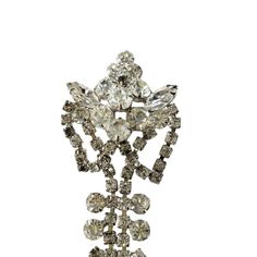 Exceptional large Vintage Clear Rhinestone Crystal  Brooch Pin Costume Jewelry Silver Toned, featuring exquisite glass crystals that add a touch of refinement, in excellent condition. Perfect for adding a touch of sophistication to any outfit, measuring 3.5" h by 1.5" w by 0.25" d. Glamorous Crystal Brooches For Formal Occasions, Glamorous Formal Brooches With Rhinestones, Formal Rhinestone Costume Brooches, Formal Crystal Embellished Brooches, Party Crystal Brooches Costume Jewelry, Crystal Rhinestone Brooches For Costume Jewelry, Crystal Rhinestone Brooches Costume Jewelry, Formal Costume Jewelry Brooches With Sparkling Stones, Formal Crystal Brooches With Rhinestones