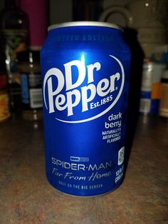 a close up of a can of soda on a table