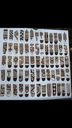 a sheet of brown and white stickers with designs on them