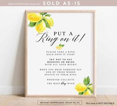 a framed print with the words, put a ring on it and two lemons