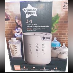 the baby bottle warmer is on display in front of a sign for tommee tippee