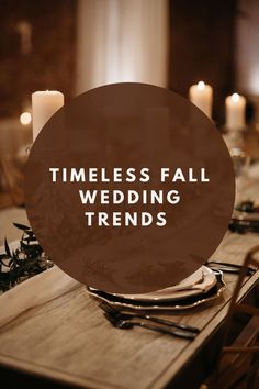 a table with candles and plates on it that says, timeless fall wedding trends