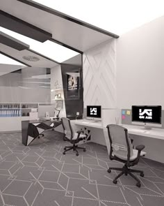 an office with two computer screens on the wall and three chairs in front of them