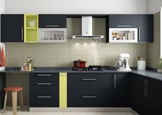 a kitchen with black cabinets and yellow trim on the countertop, along with a stool