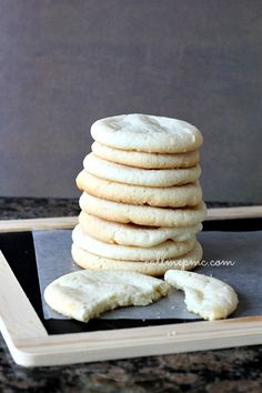 a stack of cookies sitting on top of a black plate