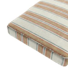 an orange and white striped seat cushion