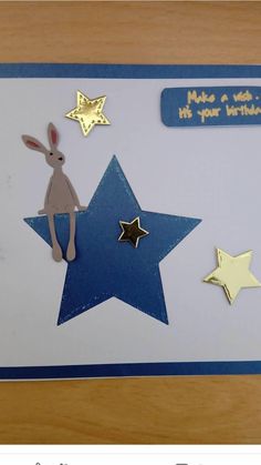 a birthday card with an image of a rabbit and stars