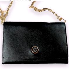 Tory Burch Robinson Chain Wallet Crossbody In Black With Gold Chain In Excellent Preloved Condition Has One Tiny White Spot On Exterior As Pictured. Not Noticeable Except Very Close Up. The Other Is Inside. This Is From My Personal Collection And Was Only Used A Couple Times. Open To Offers!! Tory Burch Robinson, Chain Wallet, Tory Burch Bag, Wallet Chain, Gold Chain, Gold Chains, Tory Burch, Close Up, Bag Lady