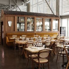 an empty restaurant with many tables and chairs