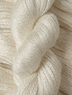 white skeins of yarn on top of each other