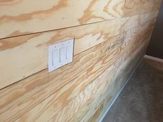 the wall is made out of plywood and has two switches on each one side