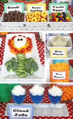 an assortment of food items displayed on trays at a birthday party or baby shower