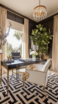 a living room with black and white rugs, chandelier, chair, table and large potted plant