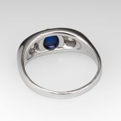 This circa 1930s ring is centered with one (1), bezel set, oval cabochon cut natural blue sapphire and flanked to each side by one (1), bezel set, old European cut diamond. The ring measures 6.7mm at the top, rises 4.5mm above the finger, tapering to 1.9mm wide and 0.8mm thick at the base of the shank. The ring is size 5.25 and would also make a great men's pinky ring. 1930s Ring, Mens Pinky Ring, Ring Mens, European Cut Diamonds, Natural Blue Sapphire, Pinky Ring, Oval Cabochon, High Quality Jewelry, Bezel Setting