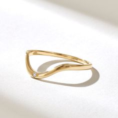 The Curved Diamond Solo Band Ring is a delicate and elegant piece of jewelry that brings a touch of sophistication and style to your everyday look. Crafted from 14k solid gold, this ring features a sleek and minimalist design. Features * Made to Order. * Gold KT: 10K, 14K, 18K * Custom Gold Color: Rose Gold, Yellow Gold, White Gold * Diamond Color-Clarity: D-E-F color VVS clarity * Total CTW: 0.02 ctw * Width of Band: 1.28MM * Thickness of Band: 0.99MM * Ready to Ship in 5-7 Business Days ✓ We care about the environment,the jewelry we cast is made with recycled gold. We source exclusively post-consumer material that is refined back to their pure elements to ensure that the gold is in the same quality. Our designs are made from 14k/18k/10k real solid gold ✓ We care about customer satisfacti Contour Ring, Simple Wedding Bands, Contour Wedding Band, Curve Ring, Arch Wedding, Diamond Stacking Rings, Plain Bands, Curved Wedding Band, Tiny Diamond