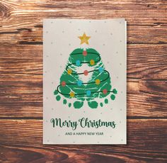 a christmas card with a green tree on it