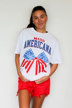 This Miss Americana oversized graphic tee is perfect for showing off your patriotic side. With its red, white, and blue design, it's both stylish and comfy. The oversized fit adds a trendy touch, making it a versatile addition to any wardrobe. Made with high-quality materials, this tee is sure to become a staple in you Summer Streetwear T-shirt With School Spirit, Trendy American Flag T-shirt For 4th Of July, 4th Of July Streetwear T-shirt With Letter Print, Summer Crew Neck T-shirt For Cheerleading, Crew Neck T-shirt For Summer Cheerleading, Short Sleeve T-shirt For Summer Cheerleading, Summer Short Sleeve T-shirt For Cheerleading, Red Americana T-shirt With American Flag, Streetwear Graphic Tee With Flag Print