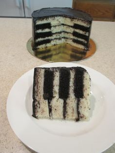 a piece of cake sitting on top of a white plate next to a slice of cake