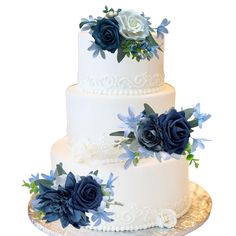 a three tiered wedding cake with blue flowers