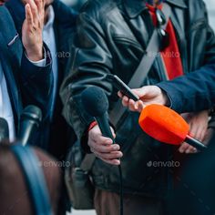 two men talking to each other while holding microphones in their hands - stock photo - images