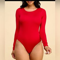 a woman in a red bodysuit posing for the camera with her hand on her hip