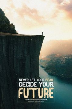 a man standing on top of a cliff next to a lake with the words, never let your fear decide your future