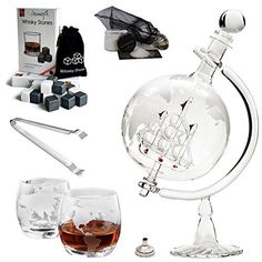 an assortment of glass items including a decanter, spoons and cups