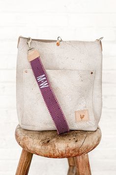 1.5" Italian webbing strap featuring a beautiful mix of dark and light lavender hues Choose your own crossbody length or shoulder strap length Vachetta/natural leather ends Solid brass hardware 2 letter monogram option available (see images) Beige Leather Bag Strap For Everyday Use, Adjustable Beige Bag Strap For Everyday, Beige Leather Handle Bag Strap For Everyday Use, Work Bag Essentials, Leather Strap Bag, Waxed Canvas Bag, English Bridle, Leather Makeup Bag, Limited Edition Bag