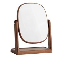 a wooden stand with a mirror on it