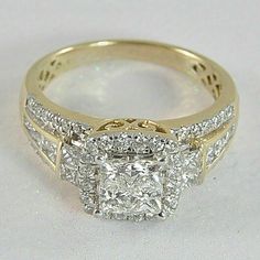 a diamond engagement ring with two rows of diamonds on the band