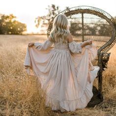 A beautiful photography piece. This is a linen blend romper with ruffled floor length skirt that opens up in front. Underneath is a pair of bloomer shorts. It is off-the-shoulder with elastic in the back. The sleeves are elastic and attached to the dress. Garment measurements (Length is top of shoulder seam to hem.) 12m chest 19in Length 22in 18m chest 20in Length 25in 2t chest 20.5in Length 30in 3t chest 21in Length 32in 4t chest 22in Length 34in 5t chest 23in Length 36in 6t chest 24in Length 3 Bohemian Dress With Smocked Back And Puff Sleeves, Bohemian Flutter Sleeve Dress For Garden Party, Bohemian Dress With Flutter Sleeves For Garden Party, Fitted Bohemian Dress With Ruffle Sleeves, Bohemian Dress With Smocked Back And Flutter Sleeves, Bohemian Flowy Maxi Dress With Puff Sleeves, Bohemian Linen Dress With Ruffles, Bohemian Cotton Dress With Ruffle Sleeves, Peasant Dress With Ruffles For Garden Party