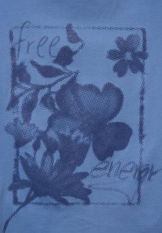 a blue t - shirt with black flowers on it