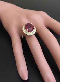 11.75 Carats Impressive Natural Red Ruby and Diamond 14K Yellow Gold Ring Suggested Replacement Value: $6,800.00 Total Red Ruby Weight is: Approx. 11.00 Carats (Lead Glass Filled) Ruby Measures: Approx. 14.00 x 11.00mm Natural Round Diamonds Weight: Approx. 0.75 Carats (color G-H / Clarity SI) Ring total weight: Approx. 7.8 grams Disclaimer: all weights, measurements and colors are approximate and may vary slightly from the listed dimensions or as seen in the image. All pictures are magnified to Luxury Oval Ruby Ring For Anniversary, Elegant Gia Certified Ruby Ring, Luxury Gia Certified Ruby Ring, Luxury Oval Ruby Ring For Formal Occasions, Luxury Ruby Ring With Center Stone For Anniversary, Luxury Ruby Ring With Center Stone For Formal Occasions, Luxury Ruby Ring With Center Stone For Formal Events, Luxury Formal Ruby Ring With Center Stone, Gia Certified Red Ruby Ring