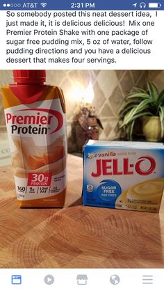 a bottle of jello sitting on top of a wooden table