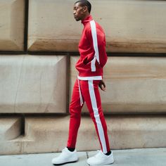 For street-ready comfort, check out the Track Pants Red White. These standard-fit pants are made from smooth and lightweight fabric. They feature ribbed cuffs and an elasticated waistband with an adjustable drawcord for a custom feel. With two side pockets and a back pocket for small essentials, these pants are finished in black color with a white side stripe. Features: Lightweight feel Comfortable and versatile Ankle length Back right pocket Ribbing at the hem White Track Pants, Ankle Cuffs, Fit Pants, Side Stripe, Striped Pants, Athletic Wear, Workout Pants, Lightweight Fabric, Extra Long