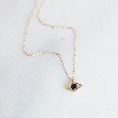 "The evil eye necklace is a symbol of protection. This sparkling CZ evil eye necklace is the perfect necklace to give as a special gift for your person or yourself! DETAILS -Evil eye charm approx. 10mm -Gold plated or silver plated with sparkling CZ crystals -A high quality delicate link chain with a spring clasp in 14kt gold filled or sterling silver. LENGTH -Measures 16 inches with a 1 1/2 inch extender for a total length of 17 1/2 inches. -You can wear this at 16 inches or 17 1/2 inches. -Als Dainty Evil Eye Charm Necklace Gift, Dainty Evil Eye Necklace For Gift, Dainty Evil Eye Necklace Gift, Elegant Evil Eye Necklace For Gift, Elegant Evil Eye Necklace Gift, Spiritual Eye-shaped Necklace For Gift, Evil Eye Jewelry Gift, Minimalist Evil Eye Charm Necklace, Dainty Eye-shaped Jewelry For Gift