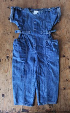 "VINTAGE 80's, great short sleeves overalls / jumpsuit, Indigo denim cotton fabric, large side pockets, metallic snap buttons and buckles. Brand \" Petit Diable \". Size 3 years Length 29,9\"  Vintage condition level 5, new old stock ( washed once ) We assess the condition of our vintage items on a scale from 0 to 5. Level 5 corresponds to an almost new vintage condition. Any defects are systematically reported. Even though in very good condition, vintage items may present imperfections due to their age, which mainly adds to their charm. I am fond of children wearing vintage clothes  They definetely look so cute   Vintage clothes are original, trendy, and often better manufactured than actual production ... It is also an opportunity for optimal recycling and a great way not to add to mass Medium Wash Short Sleeve Jumpsuits And Rompers With Buttons, Denim Overall Jumpsuit With Buttons For Summer, Medium Wash Cotton Jumpsuits And Rompers With Buttons, Cotton Medium Wash Jumpsuits And Rompers With Buttons, Summer Denim Overalls Jumpsuit With Buttons, Summer Denim Overalls With Buttons, Casual Cotton Jumpsuits And Rompers With Belt Loops, Cotton Jumpsuits And Rompers With Buttons In Medium Wash, Dark Wash Buttoned Cotton Denim Jumpsuit