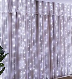 the curtain is covered with white lights