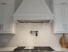 a stove top oven sitting inside of a kitchen