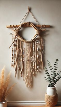 a wall hanging made out of branches and beads