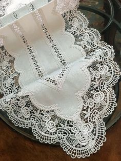 two white lace doily on a black plate