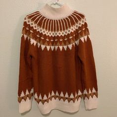 100% Acrylic White Jacquard Knit Sweater For Fall, Brown Cozy Fit Knit Outerwear, Casual Brown Fair Isle Pattern Sweater, Cozy Fit Brown Knit Outerwear, Casual Brown Top With Fair Isle Pattern, Cozy Brown Tops With Fair Isle Pattern, Winter Brown Tops With Fair Isle Pattern, Brown Knit Tops For Winter, White Jacquard Knit Winter Sweater